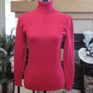 Garnet red turtleneck sweater with gold buttons